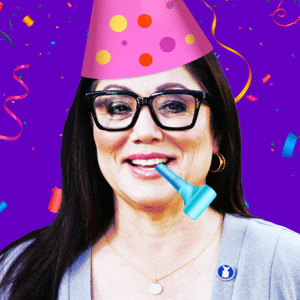 An animated GIF of Lori Chavez-Deremer wearing a birthday hat and confetti.