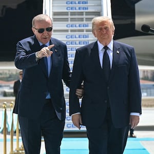 TOPSHOT - Turkish President Recep Tayyip Erdogan (L) welcomes US President Donald Trump (C) upon his arrival on Air Force One at Etimesgut Air Base near Ankara, on July 7, 2026, before attending the 36th NATO Heads of State and Government Summit. (Photo by SAUL LOEB / AFP via Getty Images)