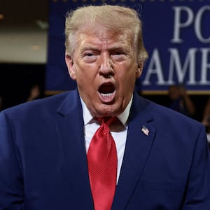 U.S. President Donald Trump gestures as he delivers remarks on the "Trump Accounts" tax-advantaged investment program at Wheeler High School in Marietta, Georgia, U.S., July 22, 2026. REUTERS/Evelyn Hockstein     TPX IMAGES OF THE DAY