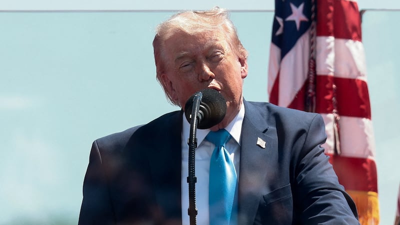 U.S. President Donald Trump stands behind protective glass as he delivers the commencement address at the U.S. Coast Guard Academy in New London, Connecticut, U.S., May 20, 2026. REUTERS/Evelyn Hockstein