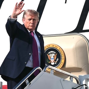 US President Donald Trump waves as he boards Air Force One before departing Joint Base Andrews, Maryland, on July 3, 2026. Trump is heading to South Dakota where he will deliver remarks at Mt. Rushmore.