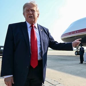 US President Donald Trump speaks to the press before he boards Air Force One for his first flight aboard the Boeing 747-8 that Qatar gifted the United States to use for executive travel, at Joint Base Andrews, in Maryland, July 1, 2026. President Trump is traveling to Medora, North Dakota to participate in the Theodore Roosevelt Presidential Library Opening Ceremony. (Photo by SAUL LOEB / AFP via Getty Images)
