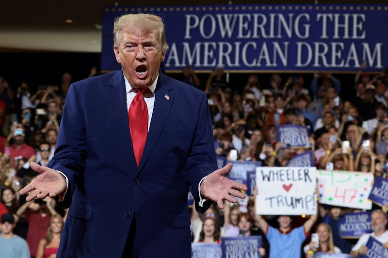 U.S. President Donald Trump gestures as he delivers remarks on the "Trump Accounts" tax-advantaged investment program at Wheeler High School in Marietta, Georgia, U.S., July 22, 2026. REUTERS/Evelyn Hockstein     TPX IMAGES OF THE DAY