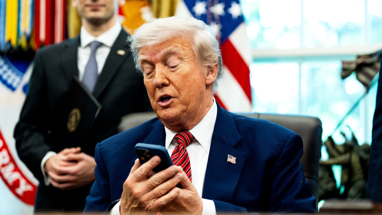 President Donald Trump silenced his cellphone in the Oval Office of the White House on Friday May 23, 2025. The executive orders were related to the nuclear power industry in the US.