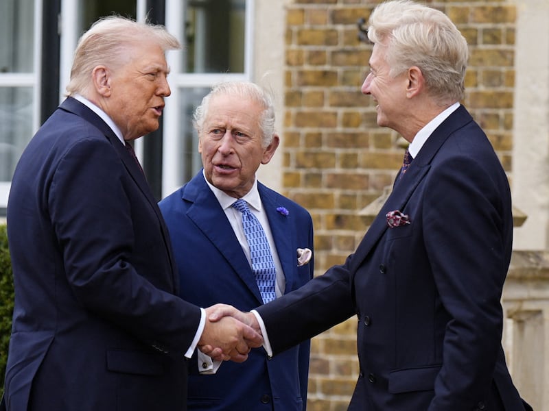 King Charles III looks on as US President Donald Trump meets Sir Clive Alderton as he arrives at Windsor Castle in Windsor, Berkshire, on day one of their second state visit to the UK. Picture date: Wednesday September 17, 2025.    /Pool via REUTERS