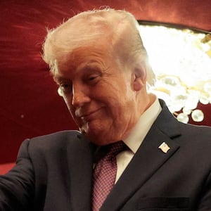 U.S. President Donald Trump gestures as he attends the opening night of 'Chicago' at the John F. Kennedy Memorial Center for the Performing Arts, renamed by the Trump administration to The Donald J. Trump and The John F. Kennedy Memorial Center for the Performing Arts, in Washington, D.C., U.S., March 31, 2026.