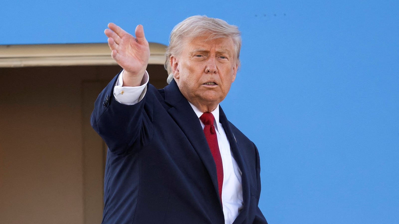 U.S. President Donald Trump gestures as he boards Air Force One at Geneva Airport following the G7 summit in nearby Evian (France), in Geneva, Switzerland, June 17, 2026. Martial Trezzini/Pool via REUTERS