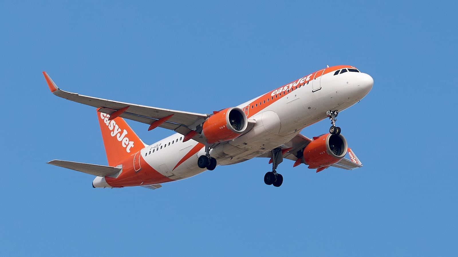 A 9H-VCO VistaJet Malta Bombardier G-A UZLB easyJet Airbus A320neo flies over the match venue during the UEFA European Under-19 Championship qualifying round group 13 soccer match between Czechia and Malta at the Centenary Stadium in Ta Qali, Malta, on November 15, 2025. (Photo by Domenic Aquilina/NurPhoto via Getty Images)