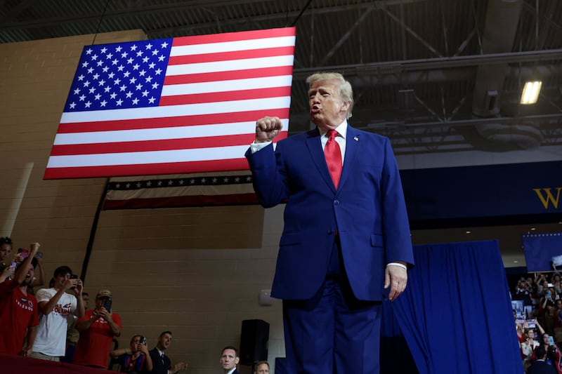 U.S. President Donald Trump gestures as he arrives to deliver remarks on the "Trump Accounts" tax-advantaged investment program at Wheeler High School in Marietta, Georgia, U.S., July 22, 2026. REUTERS/Evelyn Hockstein