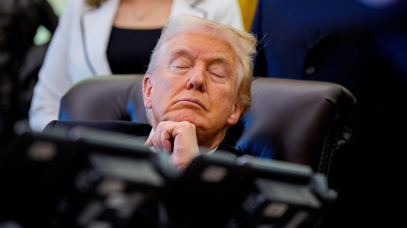 President Donald Trump with his eyes closed in the Oval Office at the White House on November 06, 2025 in Washington, DC.