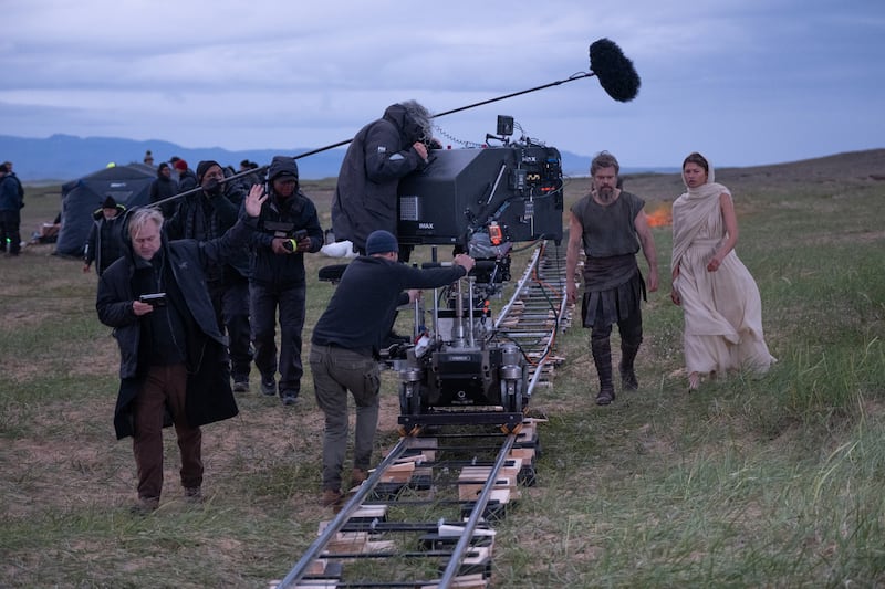 Director Christopher Nolan (frame left) with Matt Damon (as Odysseus) and Zendaya (as Athena), on set of his film THE ODYSSEY, written, produced, and directed by Christopher Nolan.