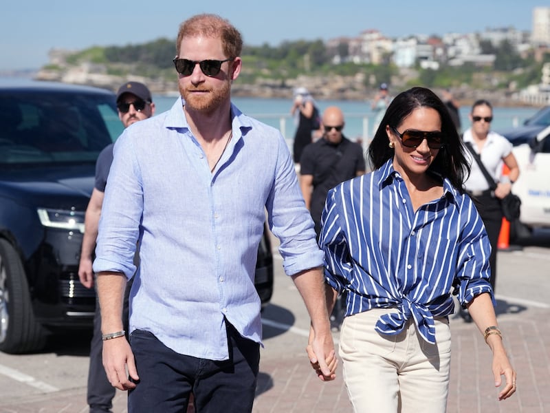 Prince Harry and Meghan, the Duke and Duchess of Sussex, arrive to meet volunteer first responders from Bondi Surf Bathers' Life Saving Club, during a visit to Bondi Beach in Australia on April 17, 2026.