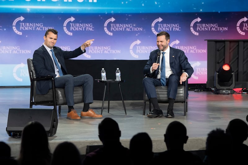 Charlie Kirk (L) moderates a conversation with JD Vance during Turning Point Action's Chase the Vote campaign event at Generation Church in Mesa, Arizona, on September 4, 2024.