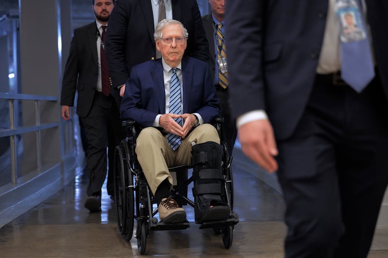 Senator Mitch McConnell (R-KY) is pushed in a wheelchair as he heads for votes at the Capitol on February 18, 2025 in Washington, DC.