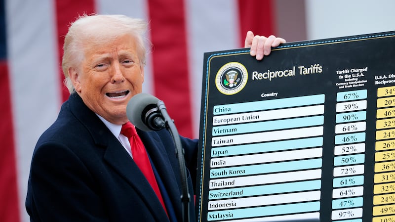 President Donald Trump holding up his tariff chart on what he called “Liberation Day” on April 2 as he has moved to impose sweeping tariffs on countries around the world since taking office.