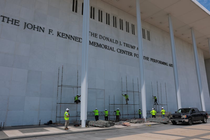 WASHINGTON, DC - JUNE 12: Construction workers build scaffolding near the sign for the Donald J. Trump and John F. Kennedy Memorial Center for the Performing Arts on June 12, 2026 in Washington, DC. The Kennedy Center board voted to seek an emergency appeal to block a court order requiring the removal of President Trump's name from the Kennedy Center. (Photo by Anna Moneymaker/Getty Images)