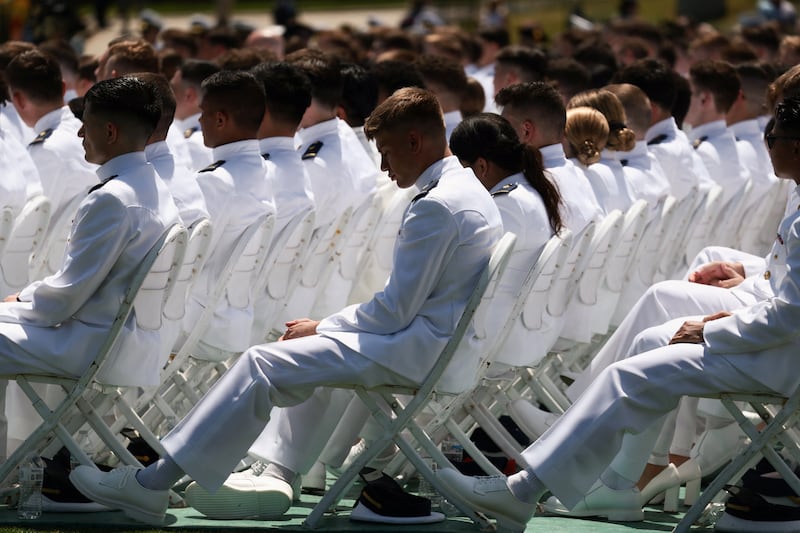 Members of the graduating class of 2026 sit together, at the United States Coast Guard Academy in New London, Connecticut, U.S., May 20, 2026. REUTERS/Evelyn Hockstein
