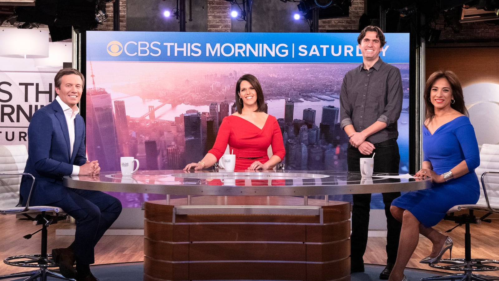 NEW YORK - APRIL 24: CBS THIS MORNING: SATURDAY co-hosts Jeff Glor, Dana Jacobson and Michelle Miller with Executive Producer Brian Applegate. (Photo by Gail Schulman/CBS via Getty Images)