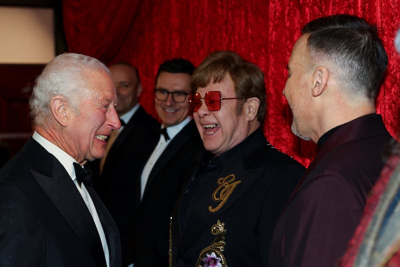 Britain's King Charles meets Elton John and David Furnish as he arrives for the Royal Variety Performance at the Royal Albert Hall, in London, Britain, November 22, 2024. REUTERS/Toby Melville/Pool