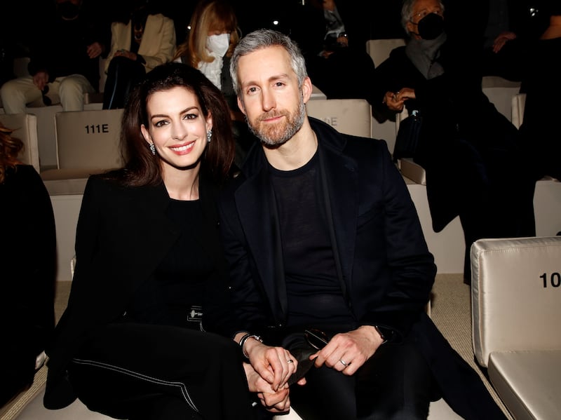 Anne Hathaway and her husband, Adam Shulman, are pictured here at Milan Fashion Week in February 2022.