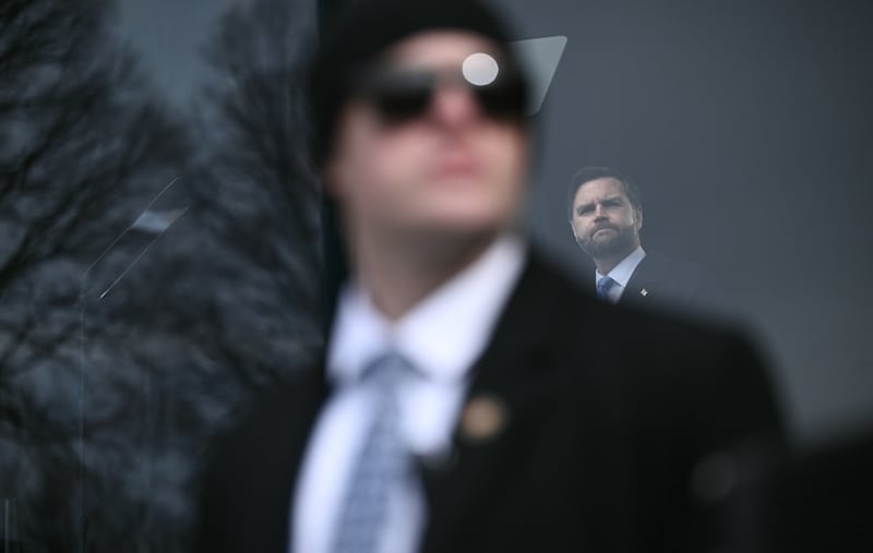 A secret Service agent watches the crowd as US Vice President JD Vance speaks behind bulletproof glass during the 53rd annual March for Life rally on the National Mall in Washington, DC, on January 23, 2026. The annual pro-life demonstration, themed "Life is a Gift," marks the anniversary of the Roe v. Wade decision and includes a march toward Capitol Hill.