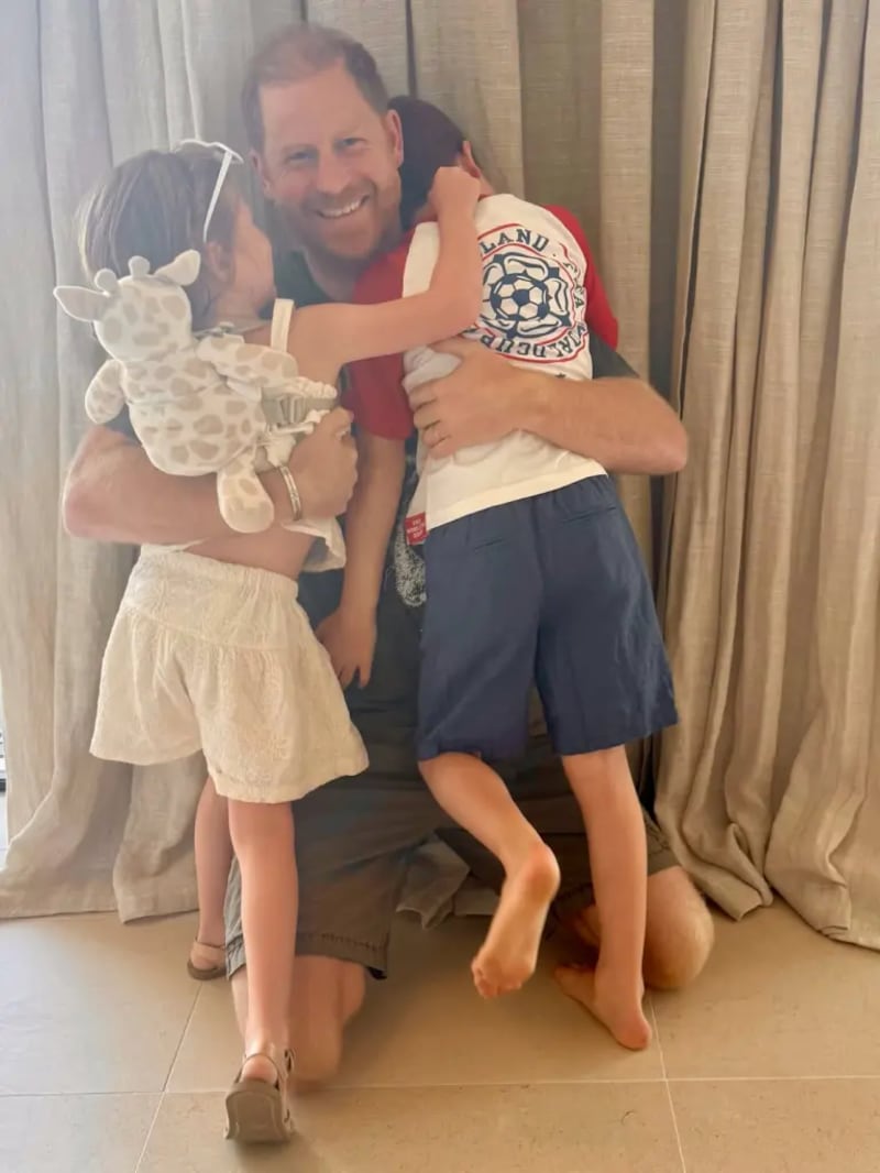 Lilibet and Archie with Harry, as seen in a photo on Meghan's Instagram.