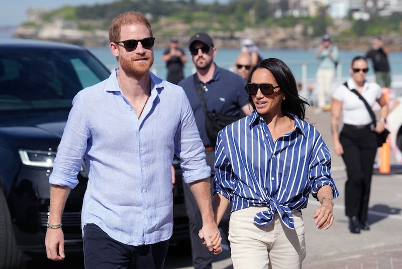 Britain's Prince Harry and Meghan, the Duke and Duchess of Sussex, arrive to meet volunteer first responders from Bondi Surf Bathers' Life Saving Club, during a visit to Bondi Beach, on day four of the royal trip to Australia, April 17, 2026.
