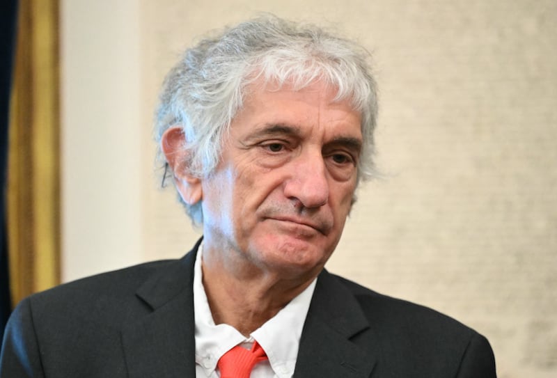 Physicist John Martinis looks on as President Donald Trump signs an executive order about quantum computing in the Oval Office of the White House in Washington, DC, on June 22, 2026.