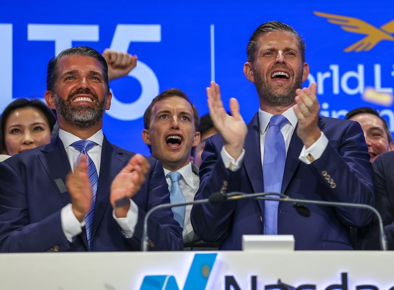 Zach Witkoff flanked by Eric Trump and Donald Trump Jr. in August.