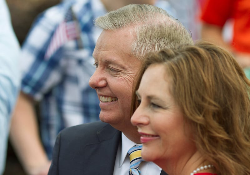 FILE PHOTO: Republican presidential candidate U.S. Senator Lindsey Graham stands with his sister Darline Graham Nordone after formally announcing his campaign for the 2016 Republican presidential nomination in his hometown Central, South Carolina June 1, 2015.  REUTERS/Christopher Aluka Berry/File Photo