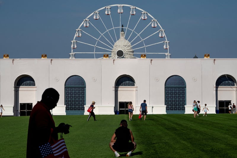 Visitors walk the grounds at the Great American State Fair on the National Mall in Washington, D.C., U.S., June 25, 2026.