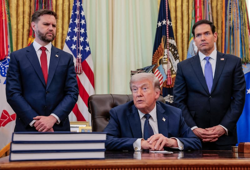 U.S. President Donald Trump speaks in the Oval Office, with Vice President JD Vance and Secretary of State Marco Rubio standing behind him, at the White House in Washington, D.C., U.S., April 23, 2026.