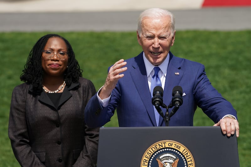Joe Biden delivers remarks on Ketanji Brown Jackson's confirmation as the first Black woman to serve on the U.S. Supreme Court, as Jackson stands at his side during a celebration event on the South Lawn at the White House in Washington, U.S., April 8, 2022.