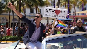 State Rep. Fabian Basabe waves to the crowd during the Miami Beach Pride Parade on April 16, 2023.