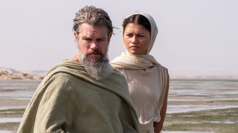 L to R: Matt Damon is Odysseus and Zendaya is Athena in THE ODYSSEY, written, produced, and directed by Christopher Nolan.